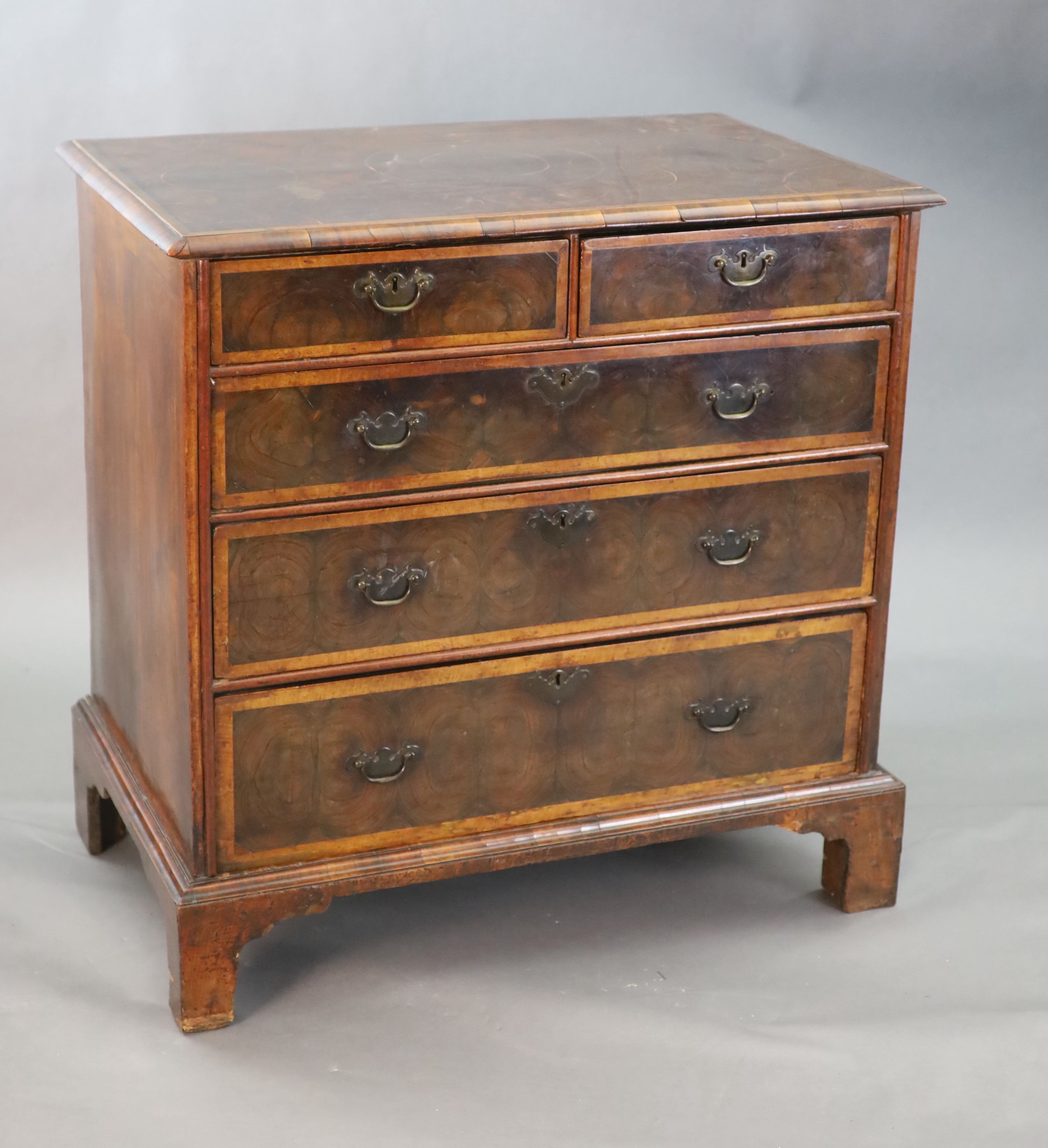 An early 18th century oyster veneered chest, W.3ft .5in. D.1ft 10in. H.3ft 1in.
